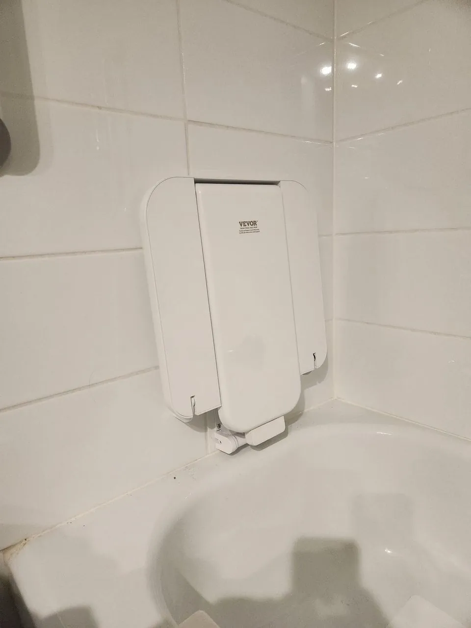 A fold-down shower safety seat fitted for a safe, supported wash after a hospital stay